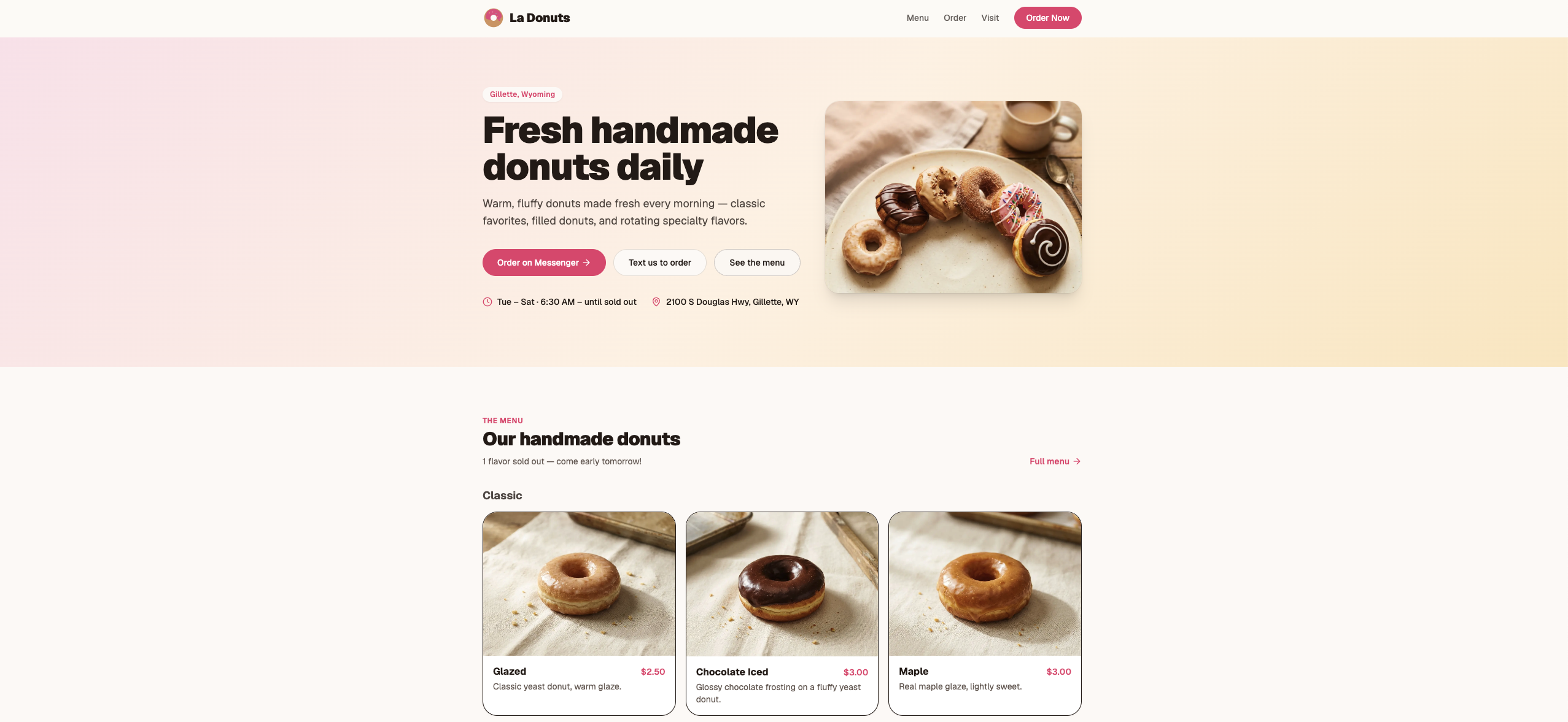 La Donuts homepage — warm pink-cream background with handmade donuts